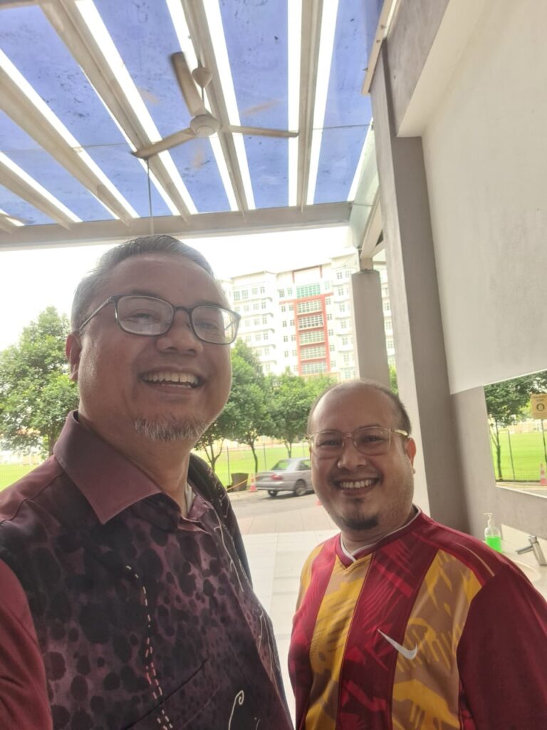 The image captures a joyous and spontaneous moment of reconnection with my respected Ustaz Kamili, symbolizing the cherished and enduring bonds forged through spiritual education